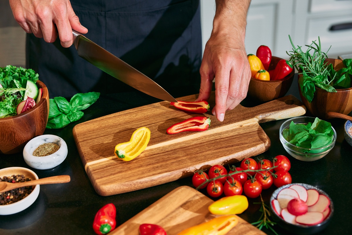 Cutting Tribelli Seedless - red and yellow- on a wooden board